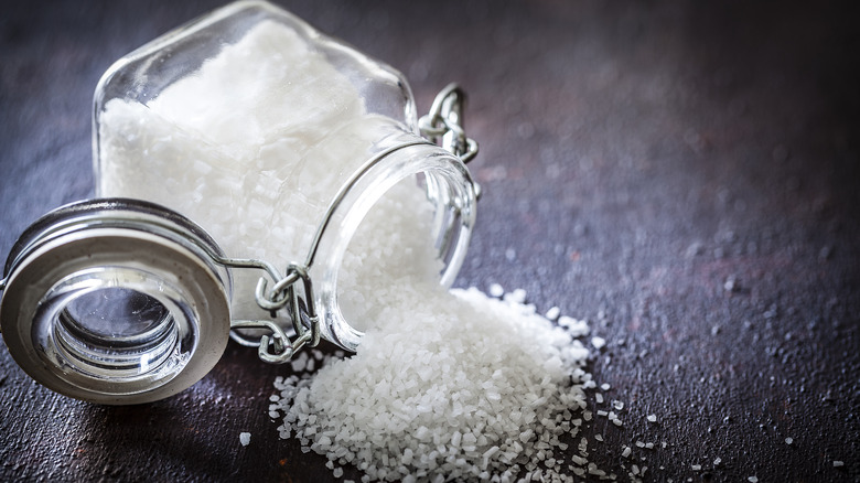 Glass container full of salt