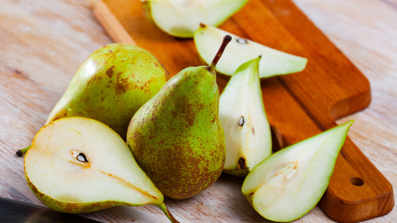 Juicy chopped pears on cutting board