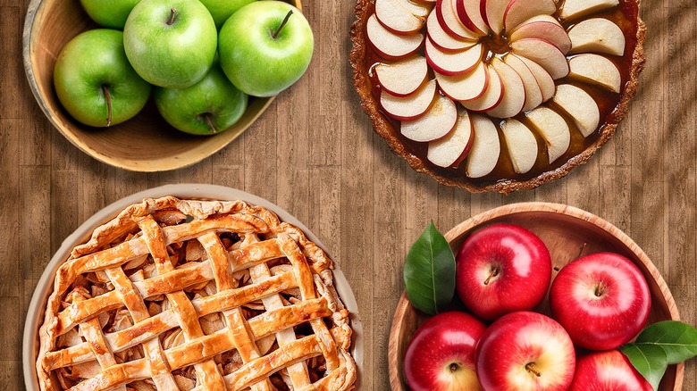 Apples on table with a green background