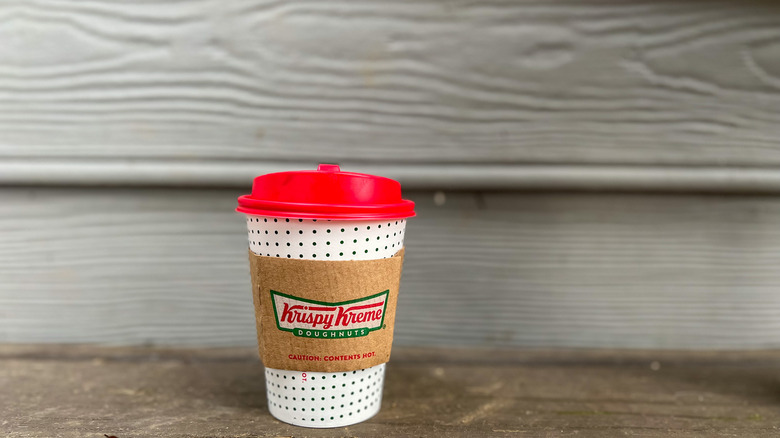 To-go cup of Krispy Kreme Ghirardelli hot chocolate