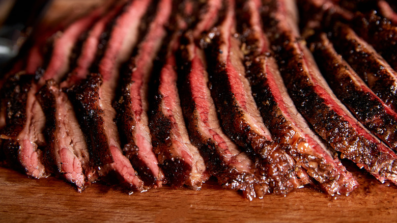 Brisket slices on wooden board