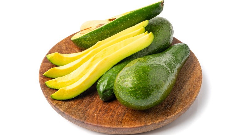 avocado on wooden board