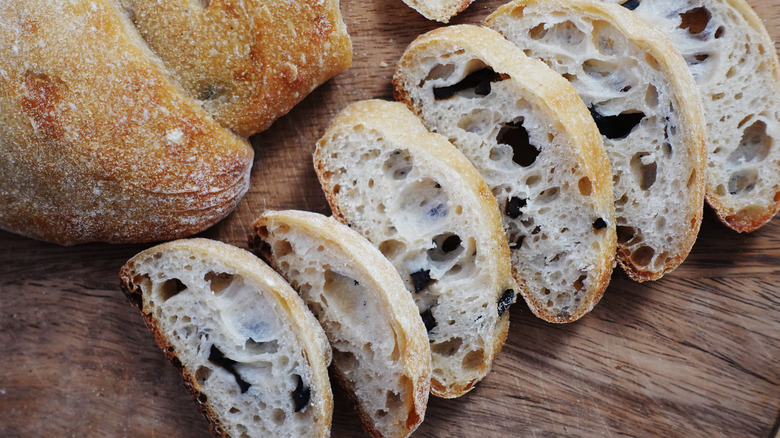 Olive sourdough cut on wood