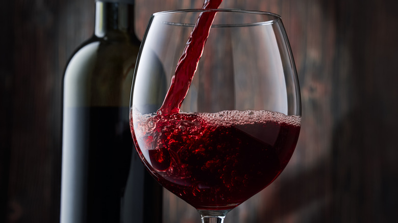 Red wine poured into glass