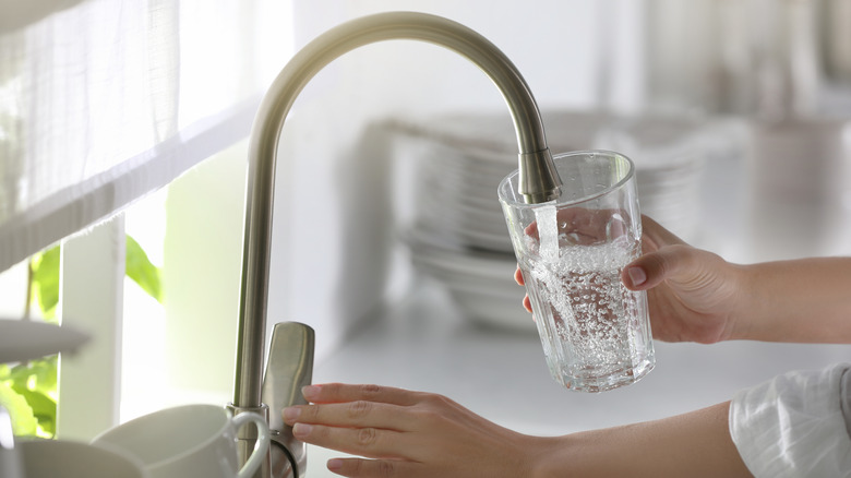 Pouring water into glass