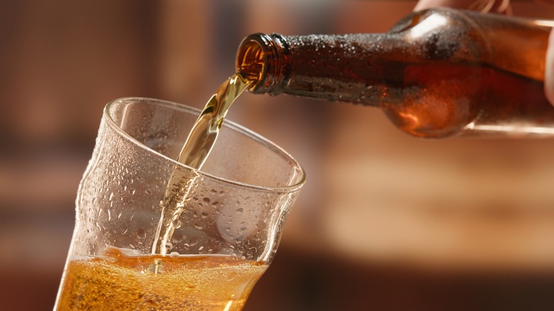 beer being poured into glass