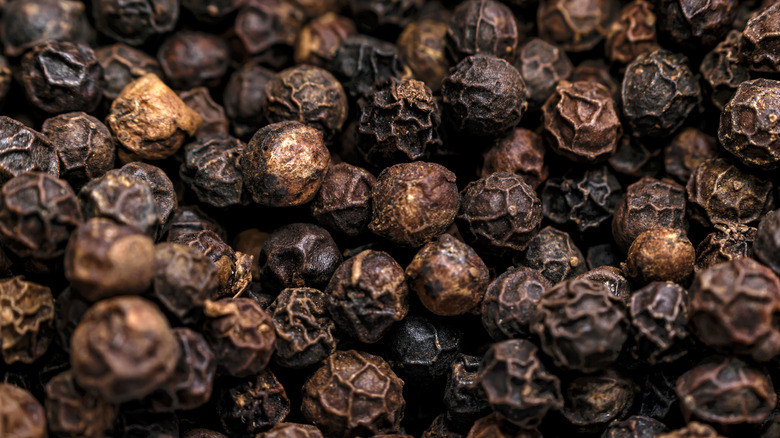 Black peppercorns in a pile