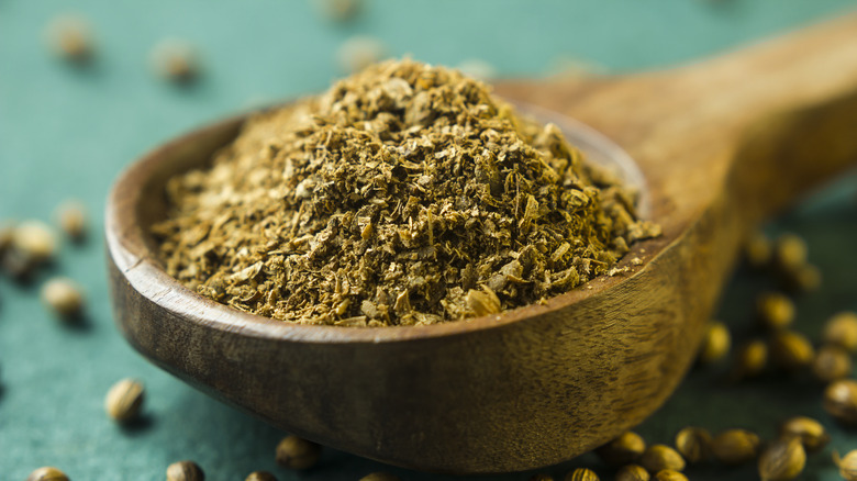 Coriander on a wooden spoon