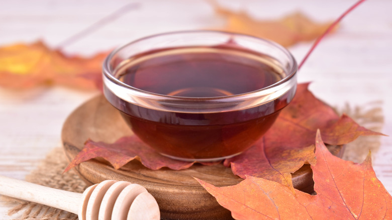 Maple syrup in a small glass bowl