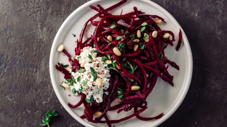 beet noodles with nuts and ricotta