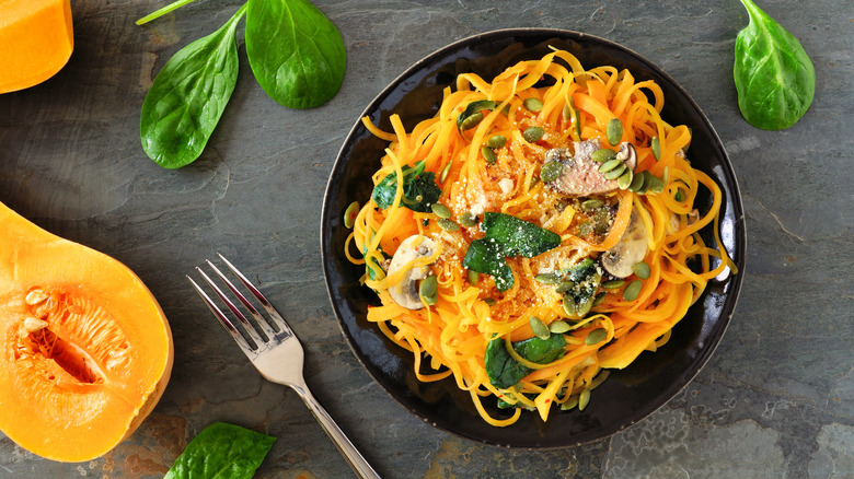 butternut squash noodles on black plate