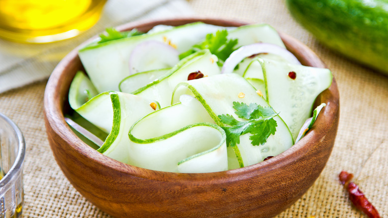 cucumber ribbon salad in wood bowl