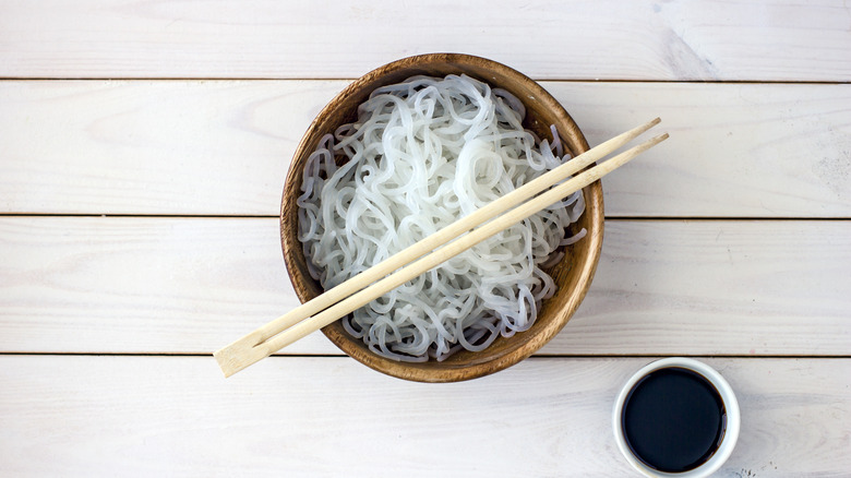 Shirataki noodles in wood bowl with chopsticks