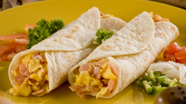 Two ham and egg breakfast burritos