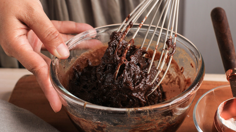 Mixing brownie batter with whisk