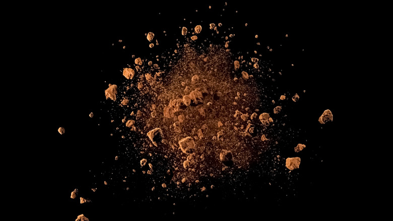 Cocoa powder on black background