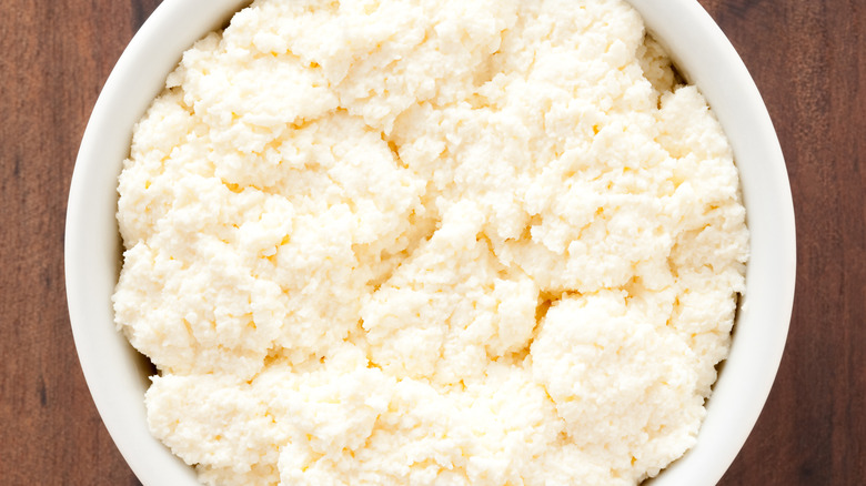 Ricotta cheese in white bowl