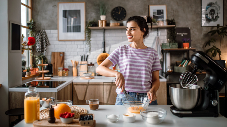 Person making cheesecake in kitchen