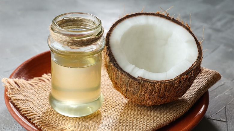 Jar of coconut oil and fresh coconut