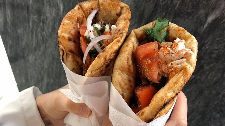 Two pitas stuffed with vegetables