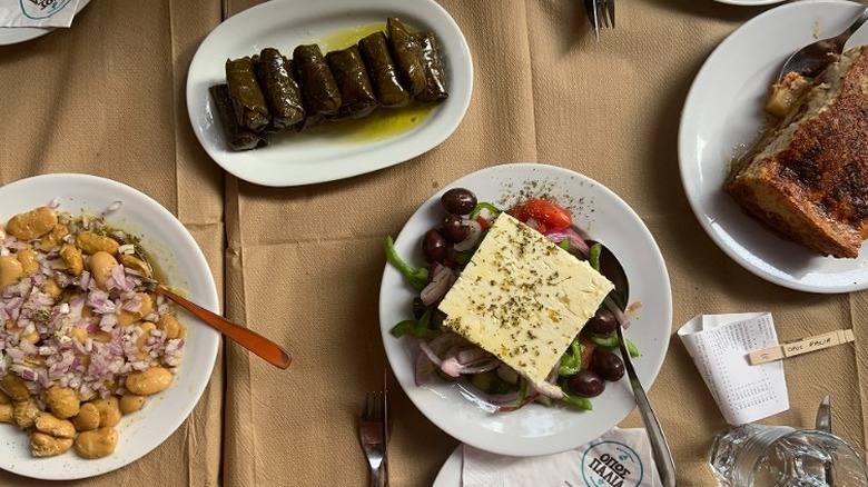 Several plates of Greek Food