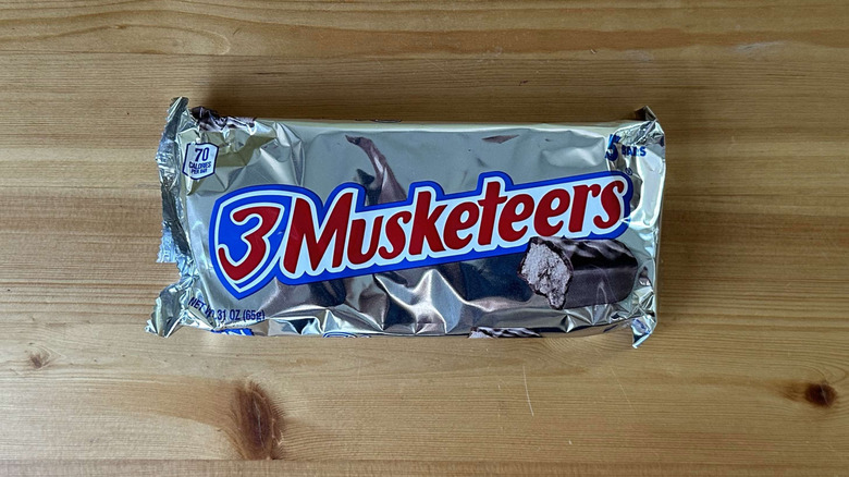 3 Musketeers candy bar on wooden table