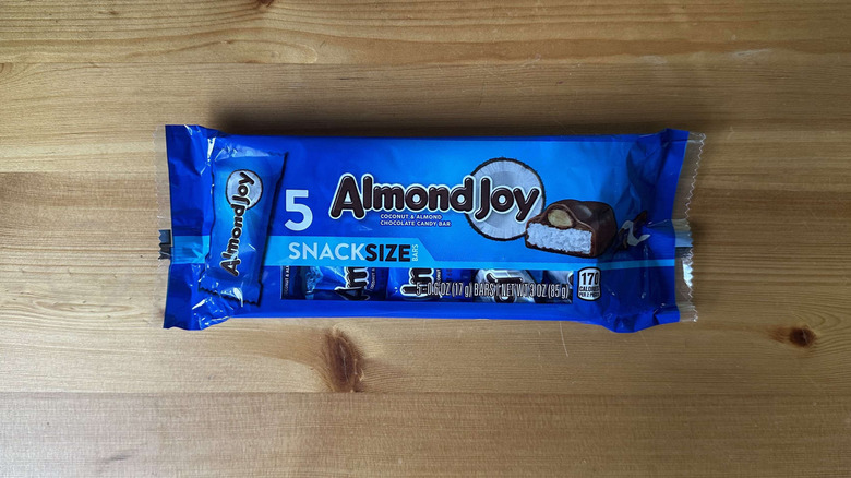 Almond Joy candy bar on wooden table