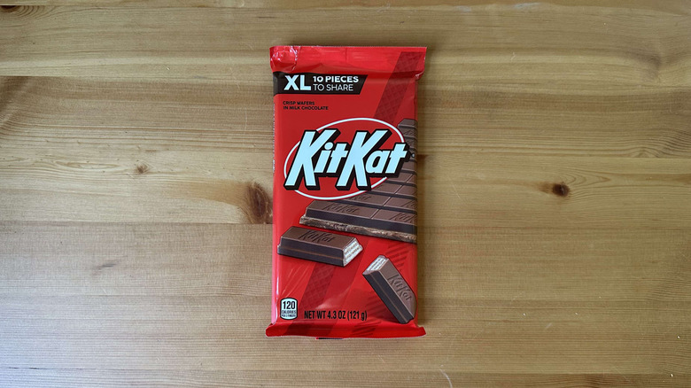 Kit Kat candy bar on wooden table