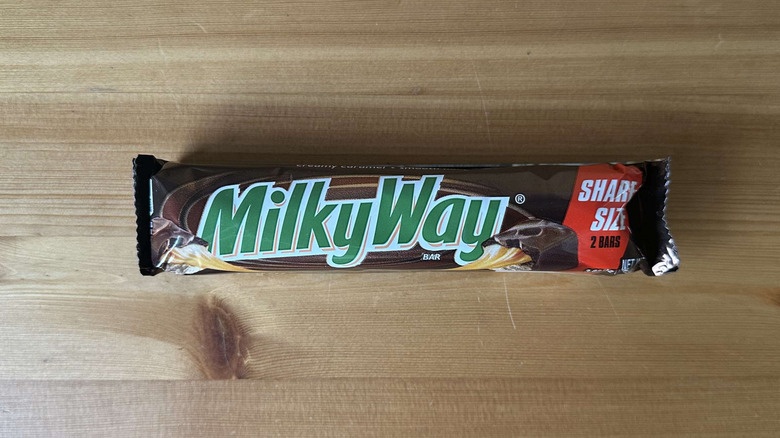 Milky Way candy bar on wooden table