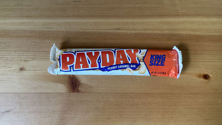 Payday candy bar on wooden table