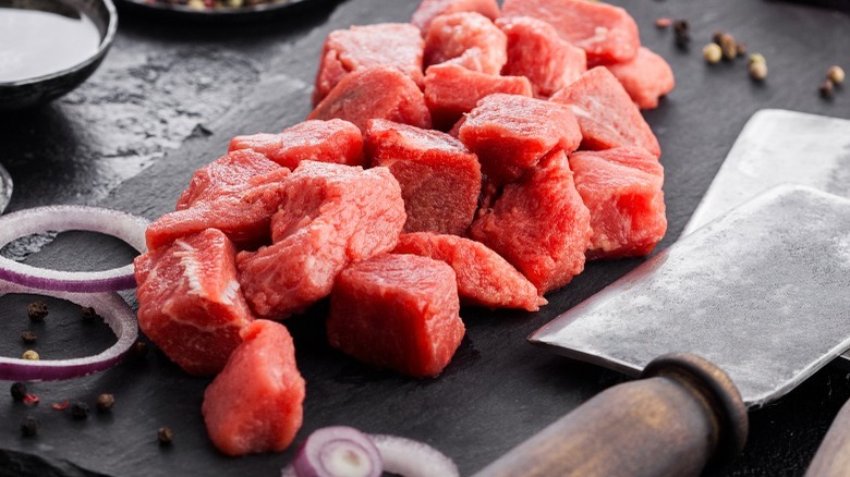 Cubed steak on cutting board