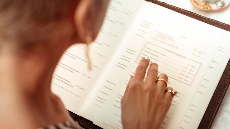 Woman looking at menu