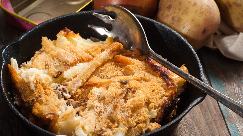 Potatoes with breadcrumbs in pan