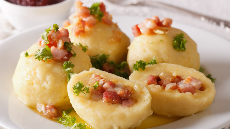 Bacon stuffed in dumplings on white plate 