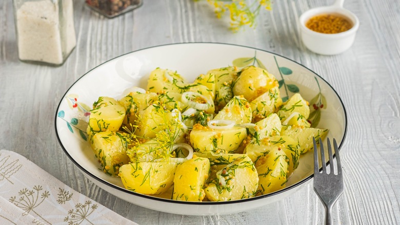 Diced potatoes in white bowl 