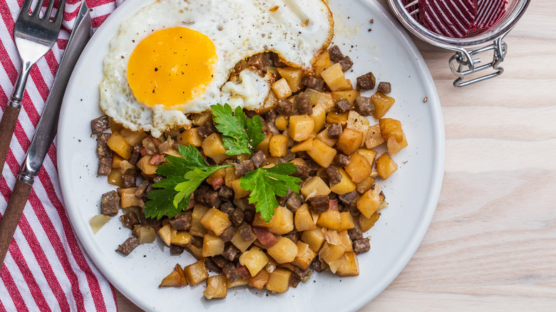 Potato hash on white plate 