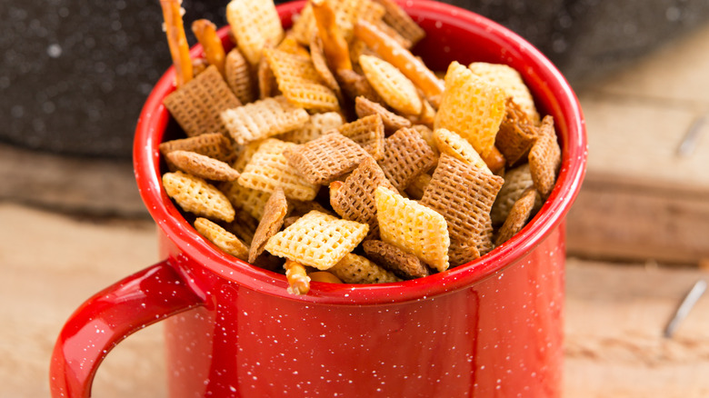 Party snack mix in a mug