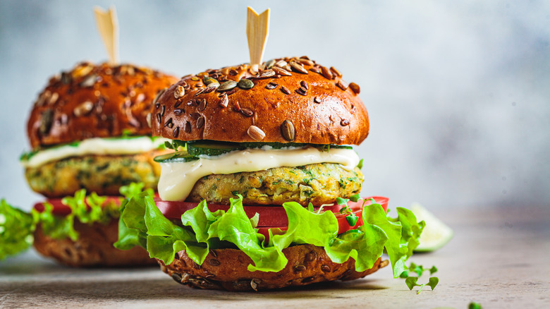 Two veggie burgers on table