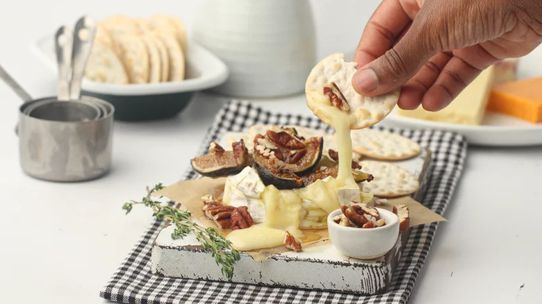 fig baked brie with gooey cheese and crackers