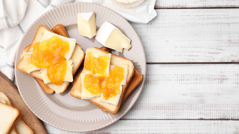 sandwiches with brie cheese and apricot jam on white