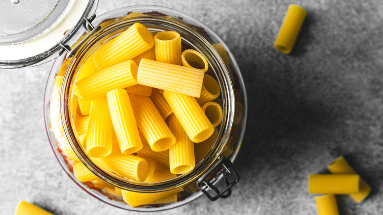 view of raw rigatoni pasta in jar