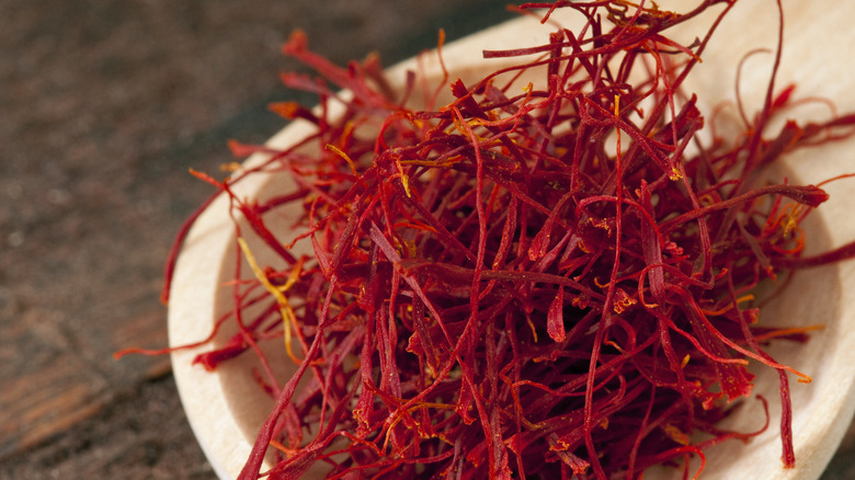 Saffron springs in wooden bowl 