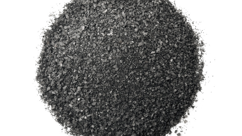 Black salt on white background