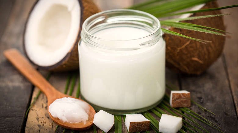 Coconut oil jar and halved fruit 