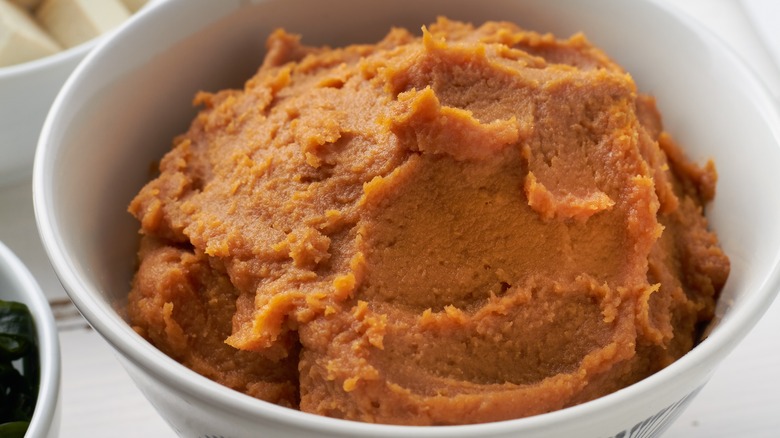 Miso paste in white bowl