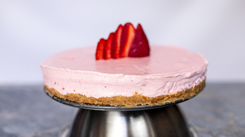 strawberry cheesecake on stand