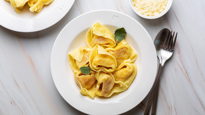 Tortelli di zucca on white plate