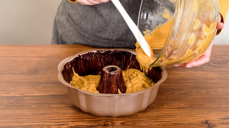 Spooning batter into a Bundt pan