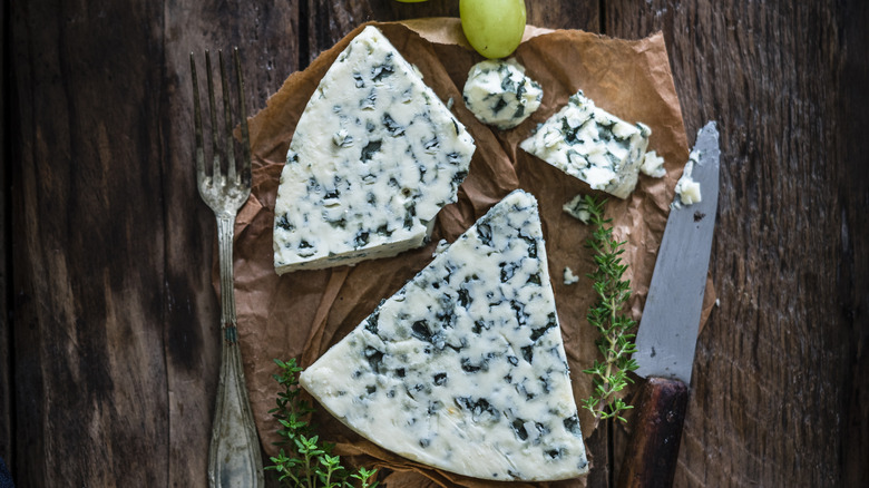 Blue cheese on wooden table