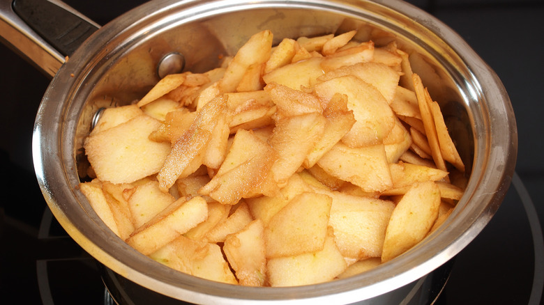 Cooking down apples in saucepan